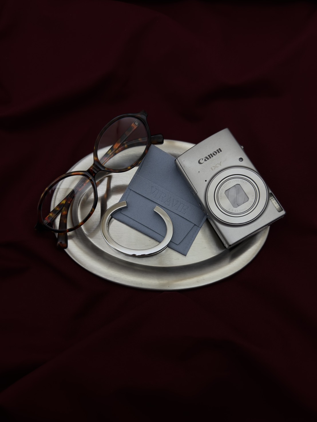 Silver VIRAVIE bracelet on burgundy fabric