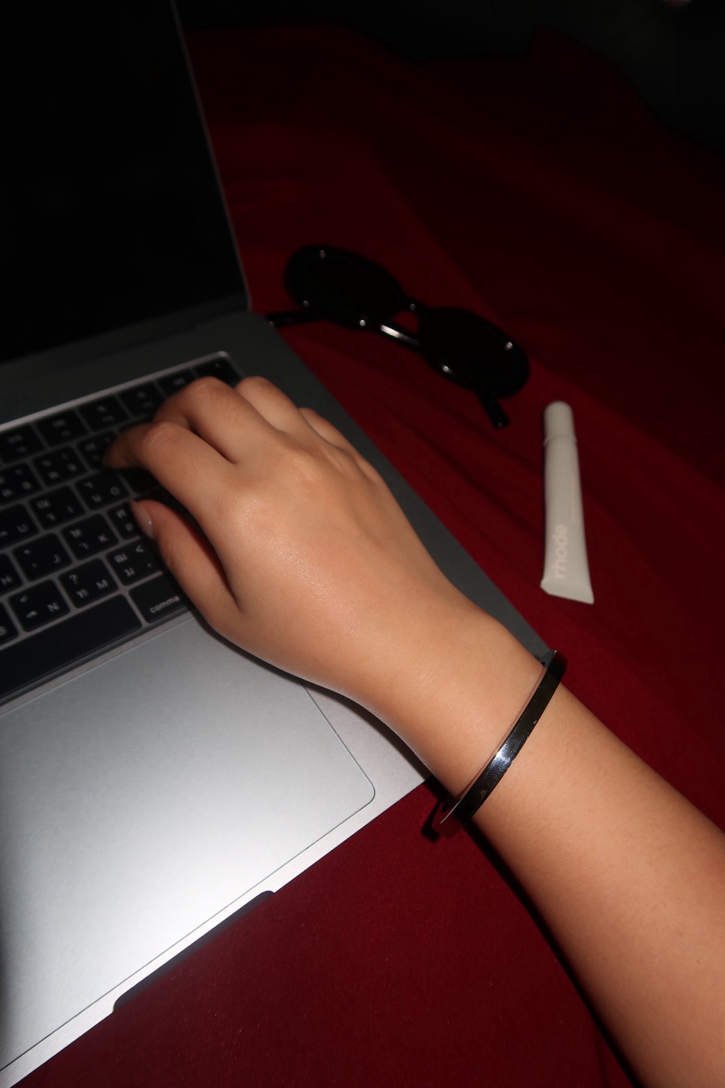 VIRAVIE bracelet worn while working on a laptop